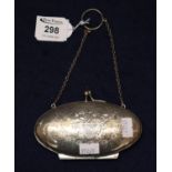 Silver oval shaped ladies hinged purse with engraved foliate decoration and initials. (B.P. 21% +