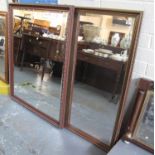 19th Century style gilt framed mirror of rectangular form with classical urn shaped decorations