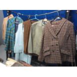 Collection of vintage clothing (60's-80's) to include; a camel skirt suit, a plaid belted long