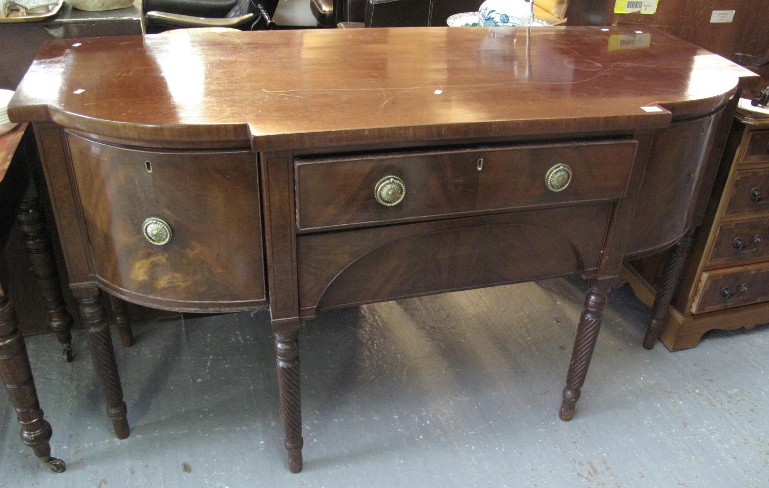 19th Century mahogany break front serpentine sideboard, standing on wrythen supports. (B.P. 21% +