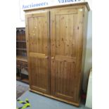 Large modern pine two door wardrobe. (B.P. 21% + VAT)