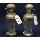 Pair of hob nail cut glass sterling silver mounted foliate repousse decorated atomiser pump action