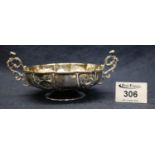 Silver wrythen and foliate repousse decorated two handled pedestal bowl, London hallmarks. 3.3
