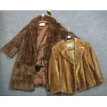 A vintage dark brown fur coat by the National Fur Company and a brown Mink fur jacket with '