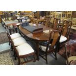 A large modern Chinese hardwood extending dining table with additional leaf, together with a set