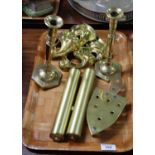 A tray of brass to include; pair of candlesticks, trivet stand, pair of long case weights and a pair