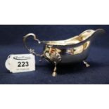 Silver sauce boat with card cut edge and hoof feet. Birmingham hallmarks, 3.2 troy ozs. (B.P.