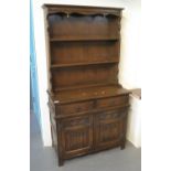 Mid Century oak Old Charm style carved two stage rack back dresser. (B.P. 21% + VAT)