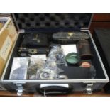 Aluminium camera case containing assorted items, camera accessories, vintage folding cameras x 2