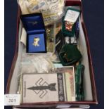 Box of assorted items to include; Golly brooches, other pin badges, ephemera, Second World War