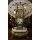 20th Century French design brass and marble figural mantel clock, the lyre shaped case with two