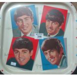 Tin tray of square form depicting the four Beatles with facsimile signatures, marked Made in Great