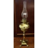 Early 20th Century brass double burner oil lamp with brass reservoir on baluster pedestal with