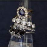 9ct gold sapphire cluster ring, silver gilt five stone ring and a crossover ring. (B.P. 21% + VAT)