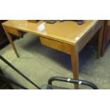 Early 20th Century oak desk having two pull out drawers standing on square tapering legs. (B.P.