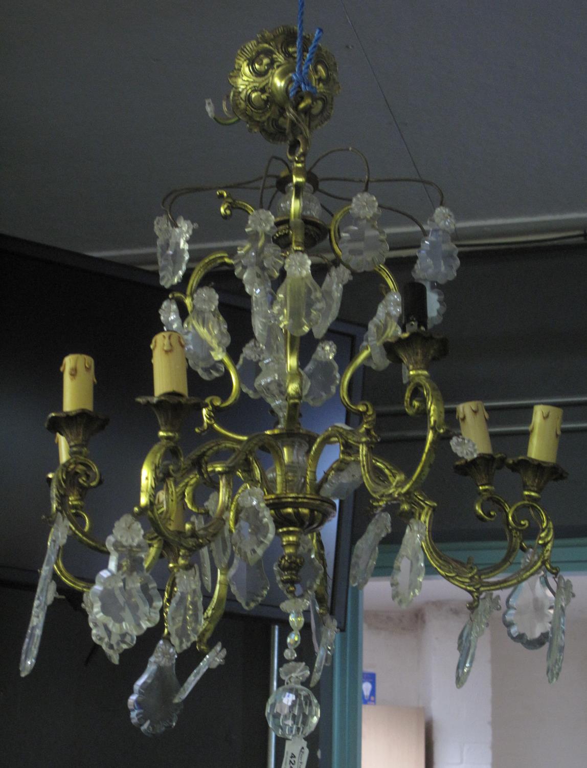 Circular gilt metal Art Deco style, three tier centre light fitting with prismatic glass spangles