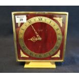 Imhof eight day Swiss mantel clock of square form on a gilt base, having gilt foliate mounts. Height