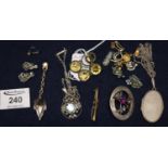 Collection of silver and costume jewellery including a silver locked, Scottish thistle brooch