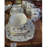 19 piece standard china part tea set, overall on a white ground decorated with enamelled flowers,