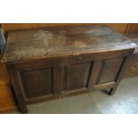 18th century oak coffer having hinged lid with candle box and three moulded panels to the front on