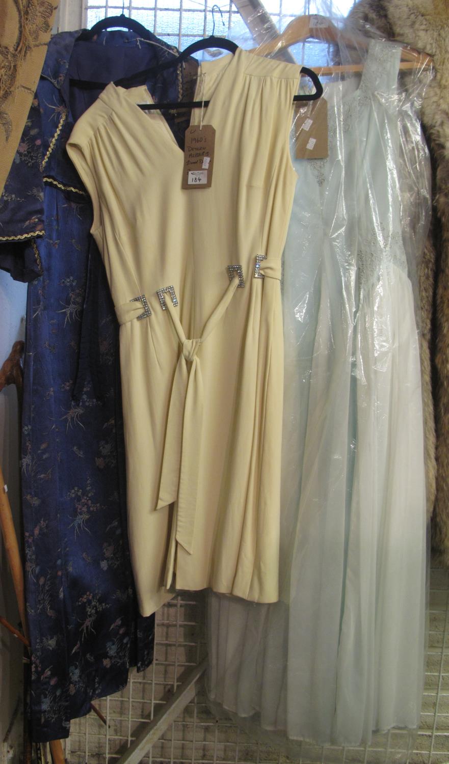 Three vintage dresses to include; a 60's empire line Chinese silk fabric dress with matching bolero,