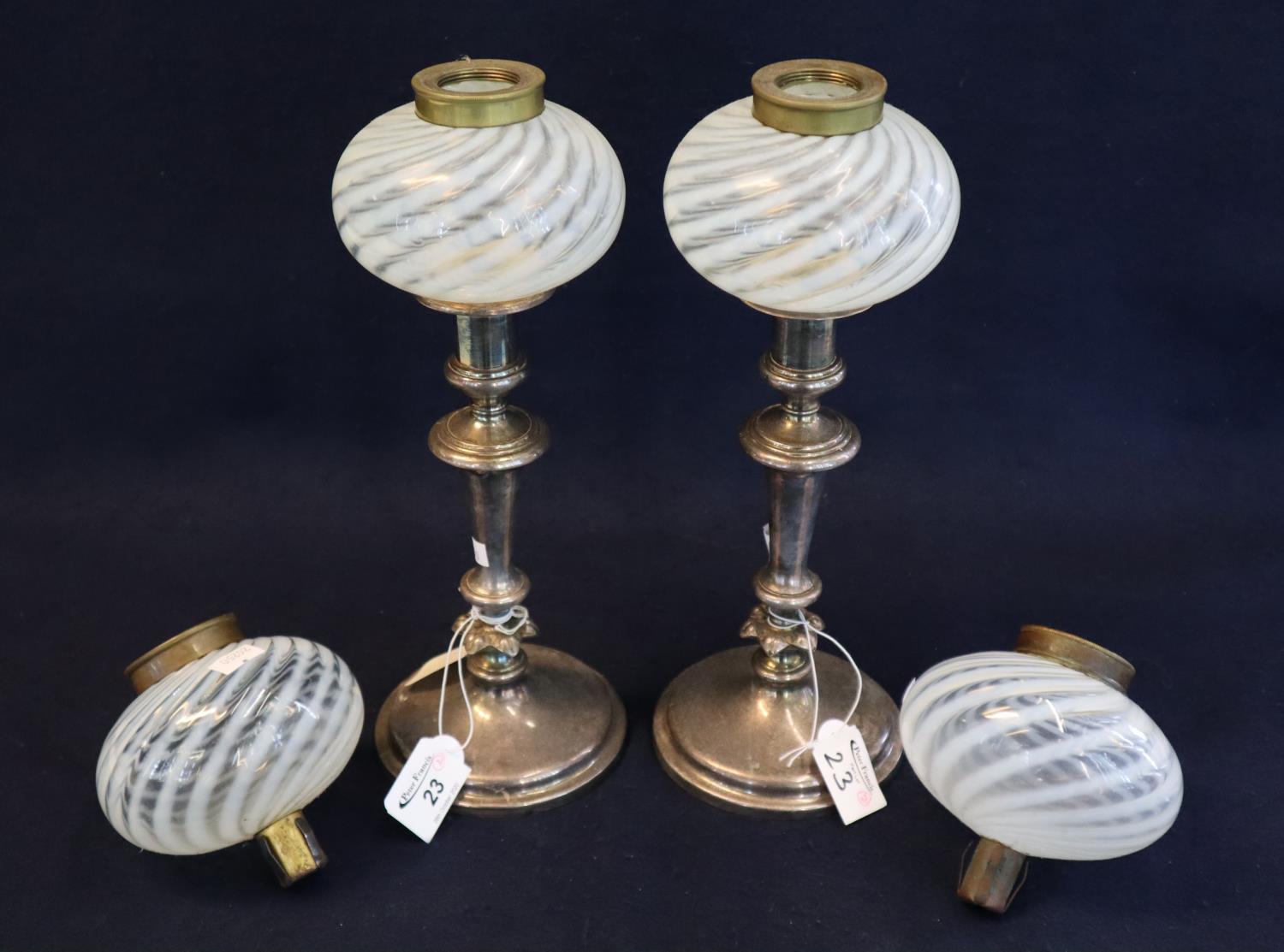 Pair of EPNS candlestick design lamp bases with two pairs of wrythen or combed Nailsea type glass,