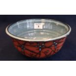 Modern art pottery bowl having blue glaze to the interior and raised splash decoration to the