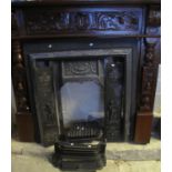 Victorian style cast iron fireplace with grate etc and carved mantelpiece. (B.P. 21% + VAT)