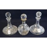Two similar cut lead crystal glass ship's decanters together with a mallet shaped cut lead crystal
