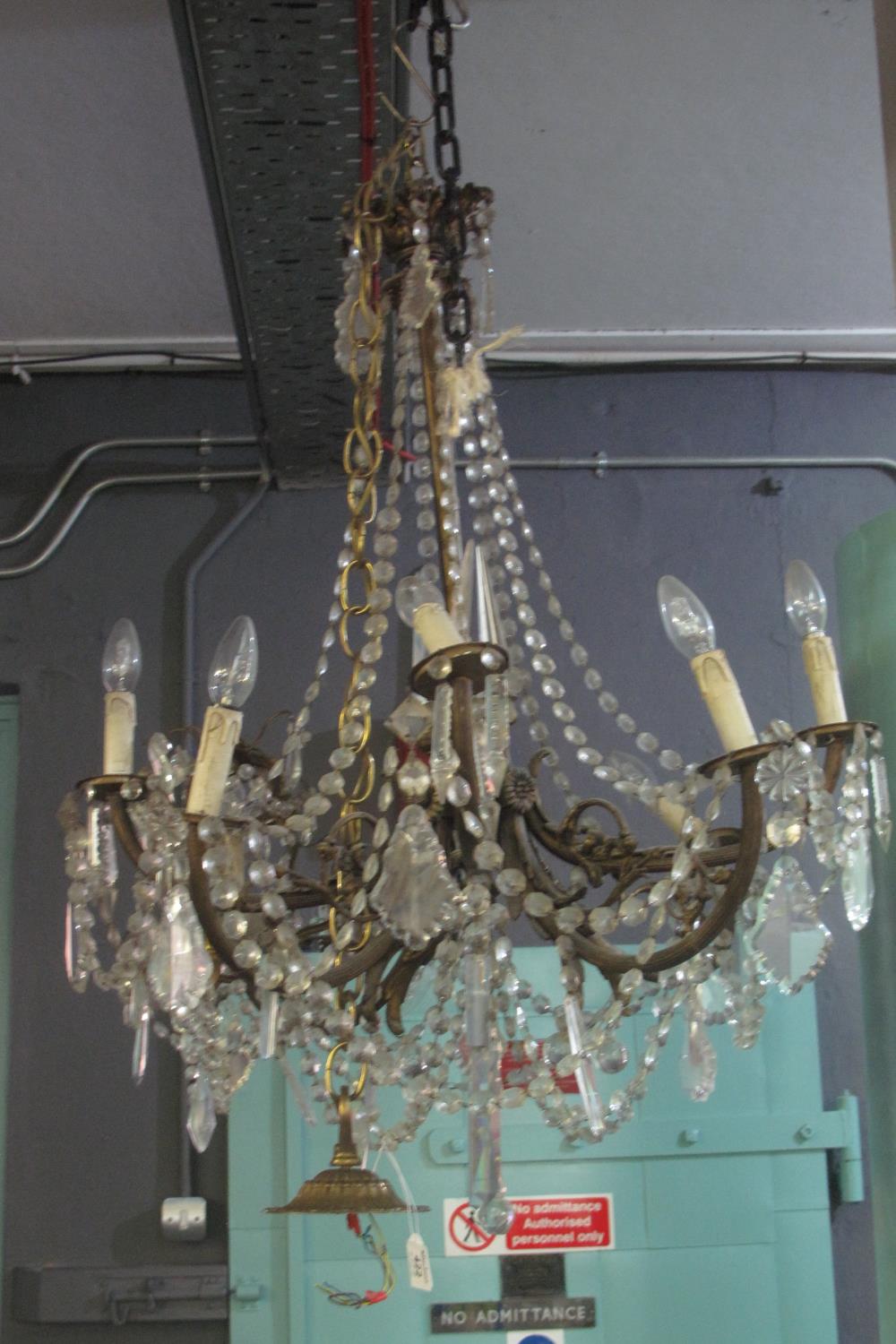 Gilt metal eight-branch chandelier light fitting overall with crystal droppers. (B.P. 21% + VAT)