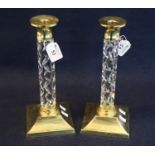 Pair of Waterford lead crystal cut glass and brass candlesticks with facet stems. 28cm high