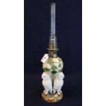 Early 20th Century single oil burner having glass chimney, the ceramic reservoir base decorated with