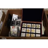 A box of ephemera and mixed modern coinage, collectors coins etc. Some American in presentation