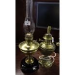 Brass double burner oil lamp with brass reservoir, brass pedestal on ceramic base with clear