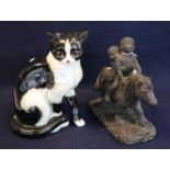 A Goebels German china study of a seated cat, 27cm approx. Together with a bronzed resin Thelwell