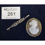 9ct gold shell cameo brooch and a yellow metal bar brooch. (B.P. 21% + VAT)