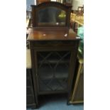 Edwardian mahogany inlaid mirror back single door glazed music cabinet on square tapering legs and