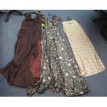 Three vintage dresses (30s-50s), to include; two patterned ball dresses; one grey silk with pink