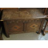18th century style oak coffer having moulded top with carved frieze and two lozenge panels, standing