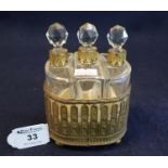 Swiss gilt metal musical box scent bottle holder, having three glass scent bottles with prismatic