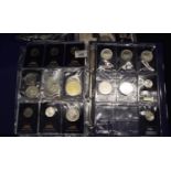 Two folders of modern coins and medallions, various, mostly cupronickel or silver plated. (2) (B.