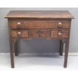 EARLY 19TH CENTURY OAK LOWBOY having moulded top above one long drawer, flanked by two smaller