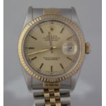 A GENT'S ROLEX OYSTER PERPETUAL DATEJUST WATCH having round stainless steel case with 18ct yellow