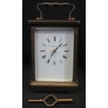 MATTHEW NORMAN OF LONDON 8 DAY BRASS FRAMED CARRIAGE CLOCK, having beveled glass panels, 11 jewel