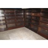 A RUN OF EARLY 20TH CENTURY GLOBE WERNICKE FIVE SECTIONAL GLAZED BOOKCASES with unusual central
