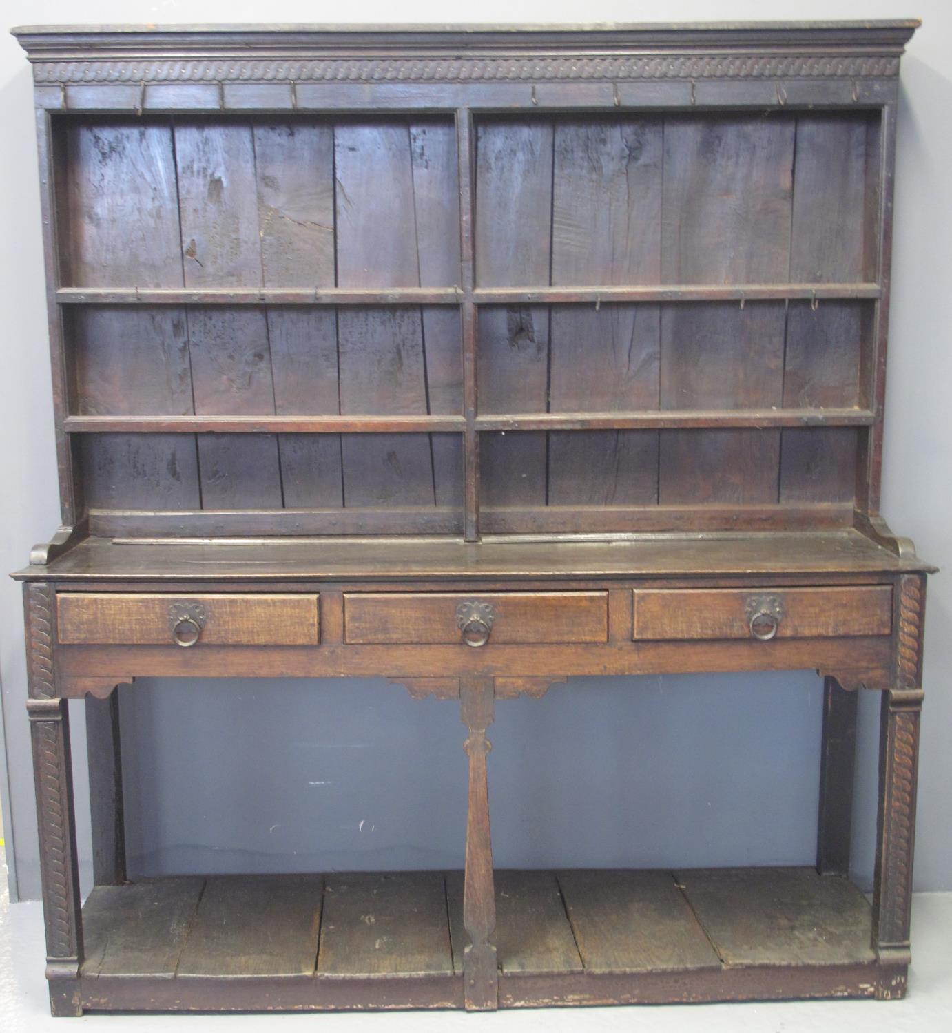 18TH CENTURY OAK TWO STAGE RACK BACK POT BOARD DRESSER having moulded cornice above 'missing' shaped