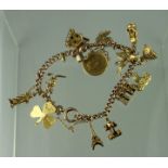 9CT GOLD CHARM BRACELET with various charms including a 1912 half sovereign, kangaroo, pegasus