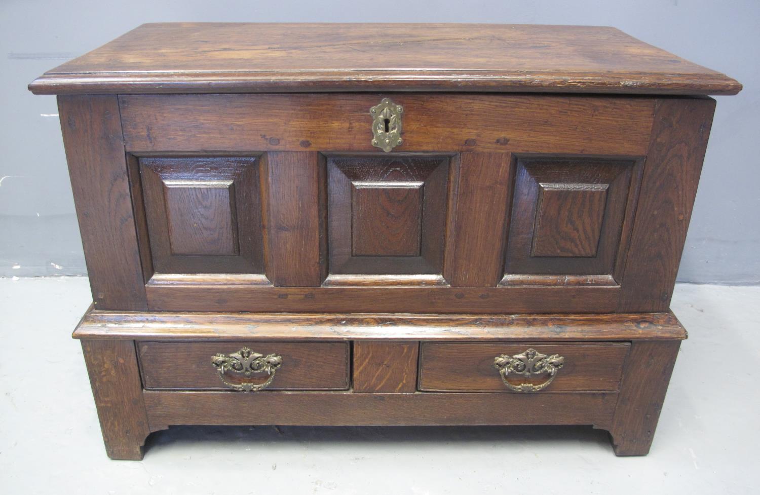 18TH CENTURY STYLE WELSH OAK COFFWR BACH having moulded top above three square fielded panels, the