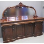 VICTORIAN MIRROR BACK SIDEBOARD having carved and moulded foliate decoration, above a moulded top,