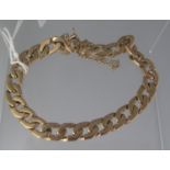 9CT GOLD FLATTENED CURB LINK BRACELET with safety clasp and safety chain. Weight 28.9g approx. (B.P.